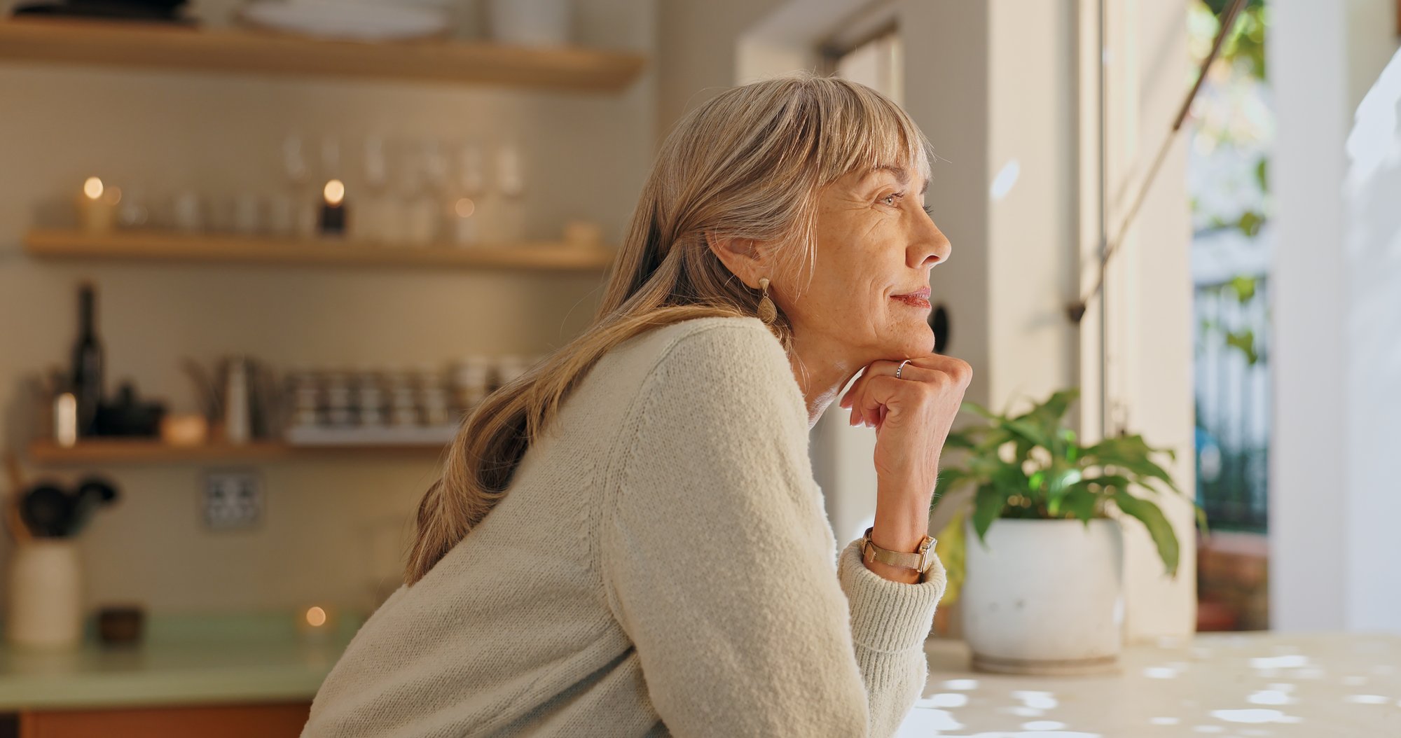Older Woman looking out a window Older Woman looking out a window